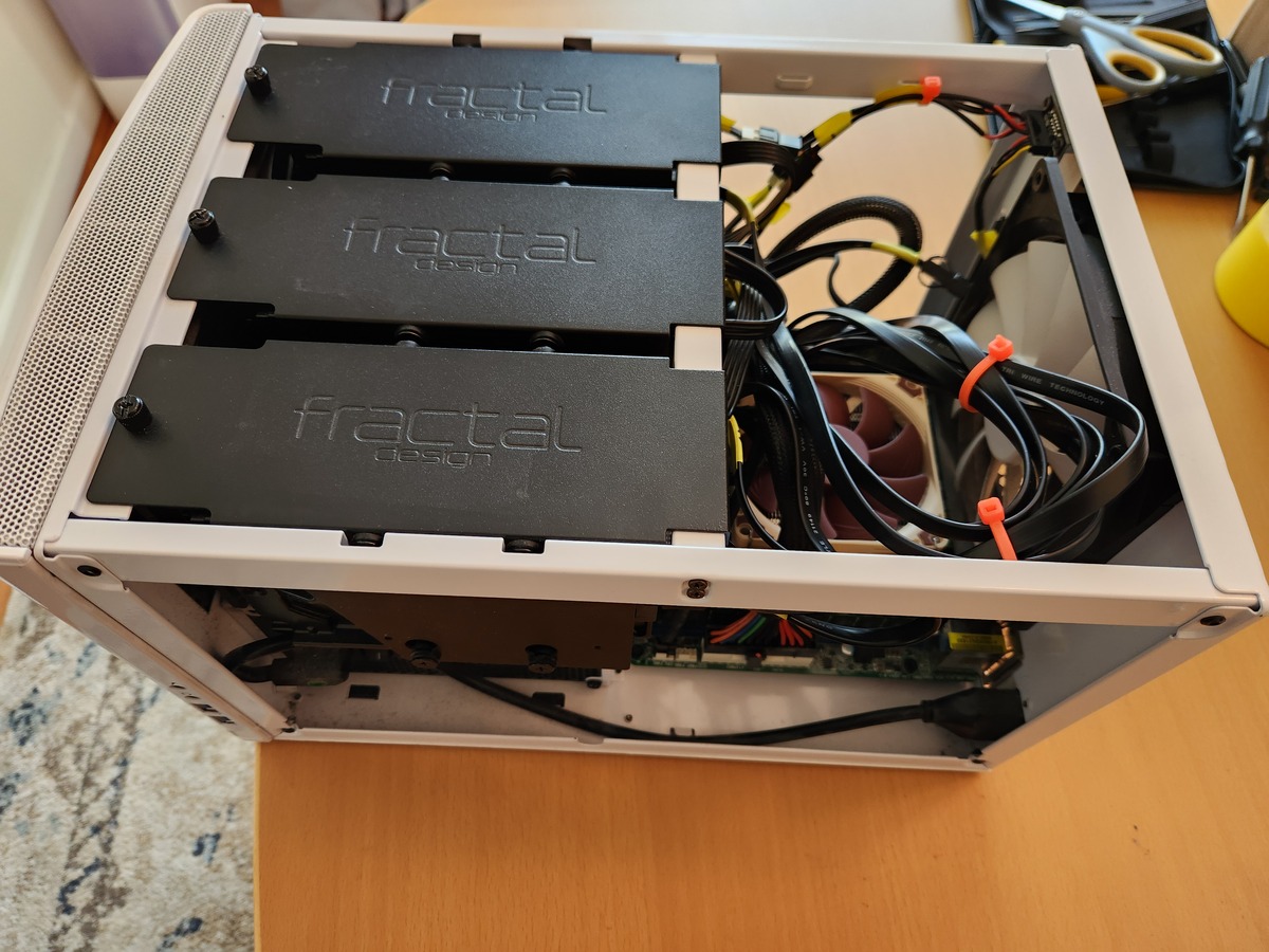 Cable management was never my strong suit, and the screws on top in this pic are the wrong ones. NAS reassembled